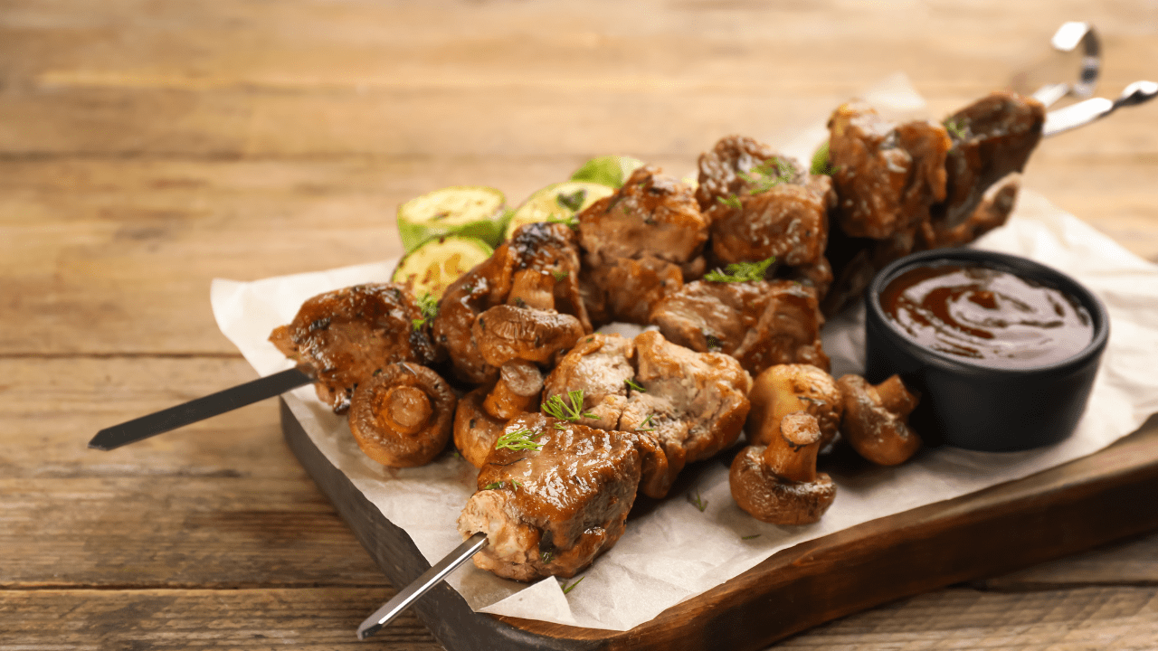 Chicken kebab and sauce on a tray